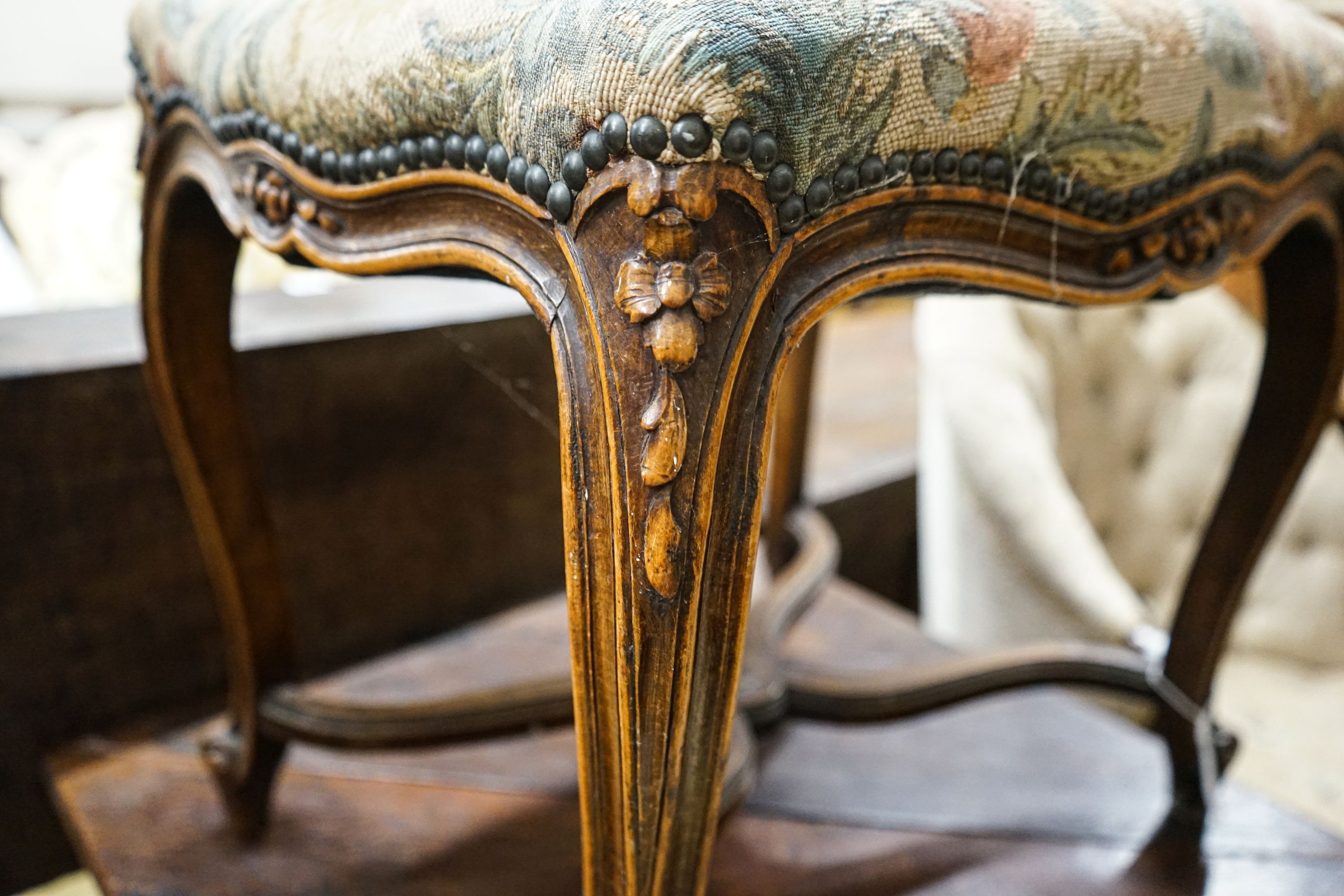 A French stained beech cabriole leg dressing stool with saltire stretcher, width 54cm, depth 41cm, height 51cm